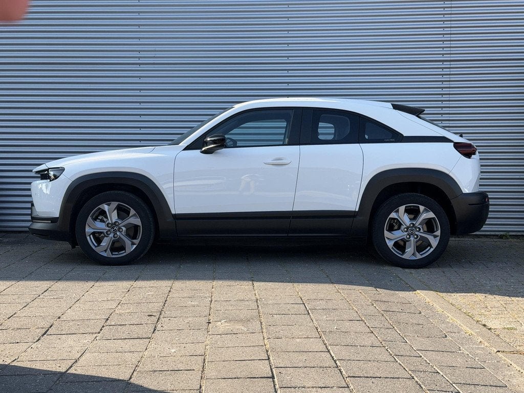 Mazda MX-30 e-SkyActiv 145 Comfort 36 kWh |SOH 96% | Eerste, Auto's, Mazda, 145 pk, Gebruikt, Zwart, Leder en Stof