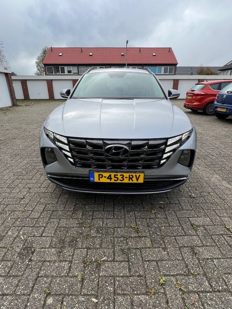 Hyundai Tucson 1.6 T-gdi HEV 230pk Aut. 2022 Grijs, Auto's, Zwart, 4 cilinders, 179 pk, 1650 kg