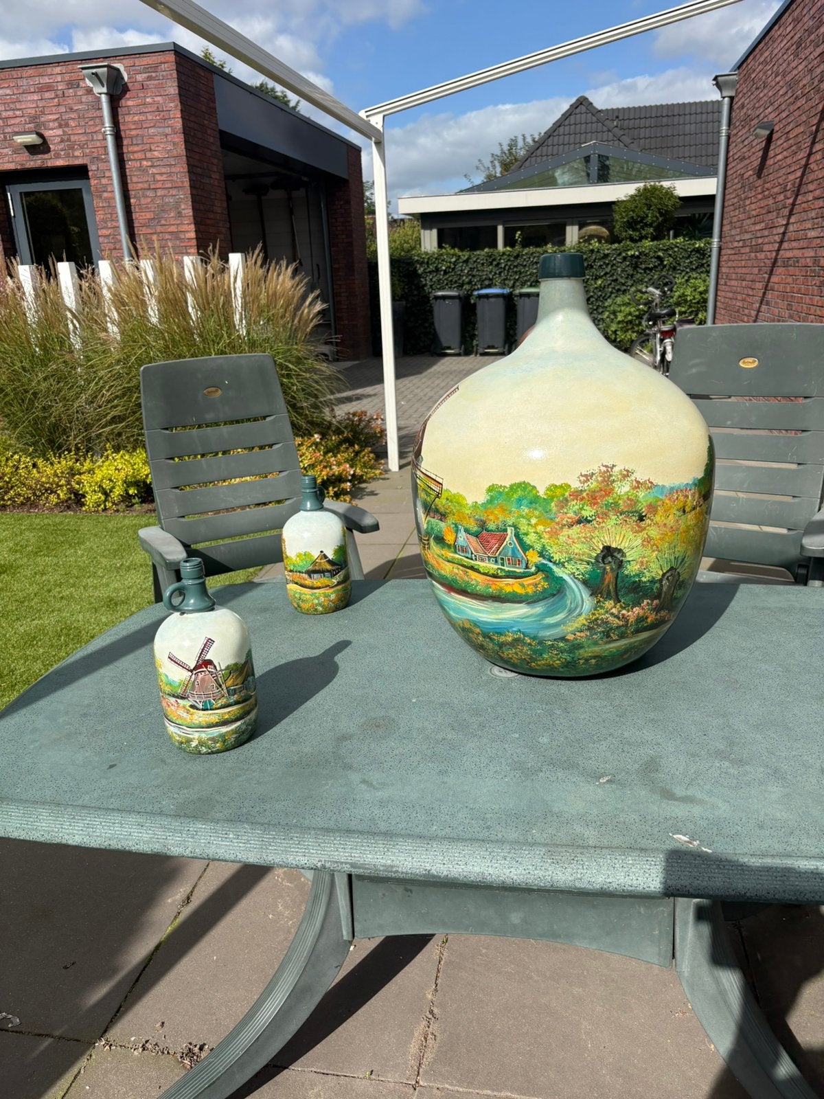 Landschap geschilderde kruiken, Ophalen
