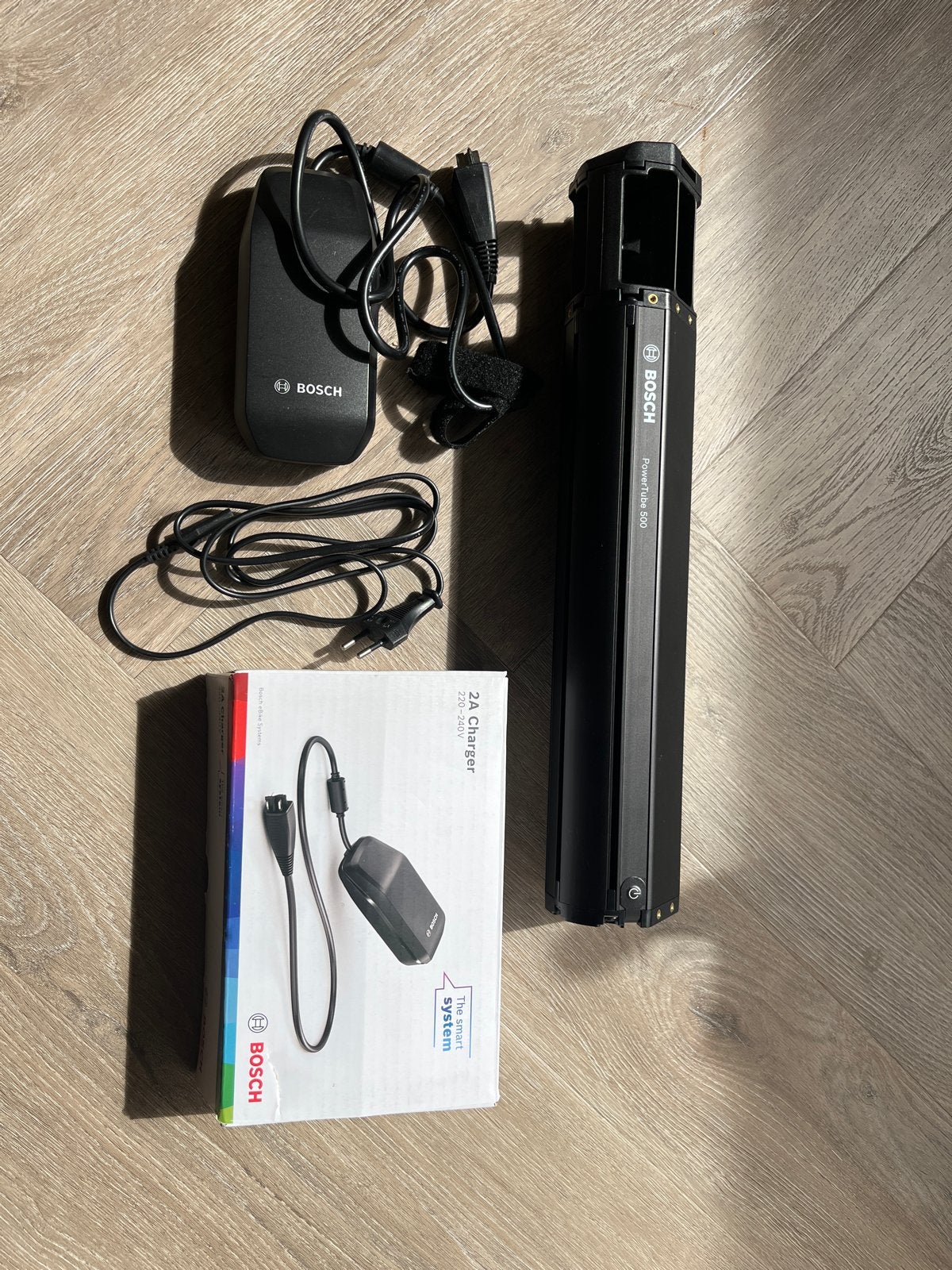 Bosch PowerTube 500 accu en 2A oplader voor e-bike, Fietsen en Brommers, Fietsaccessoires | Fietsaccu's, Ophalen, Zo goed als nieuw