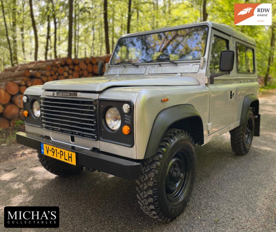 Land Rover Defender 1985 ZILVER 7-persoons 90 BELASTINGVRIJ!, Auto's, Land Rover, 2500 cc, Zwart, 4 cilinders, Leder