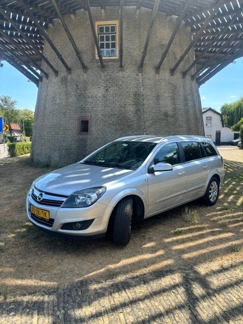 Opel Astra 1.6 16V 85KW Stationwagon grijs (2008) + trekhaak, Voorwielaandrijving, 4 cilinders, 635 kg, Origineel Nederlands