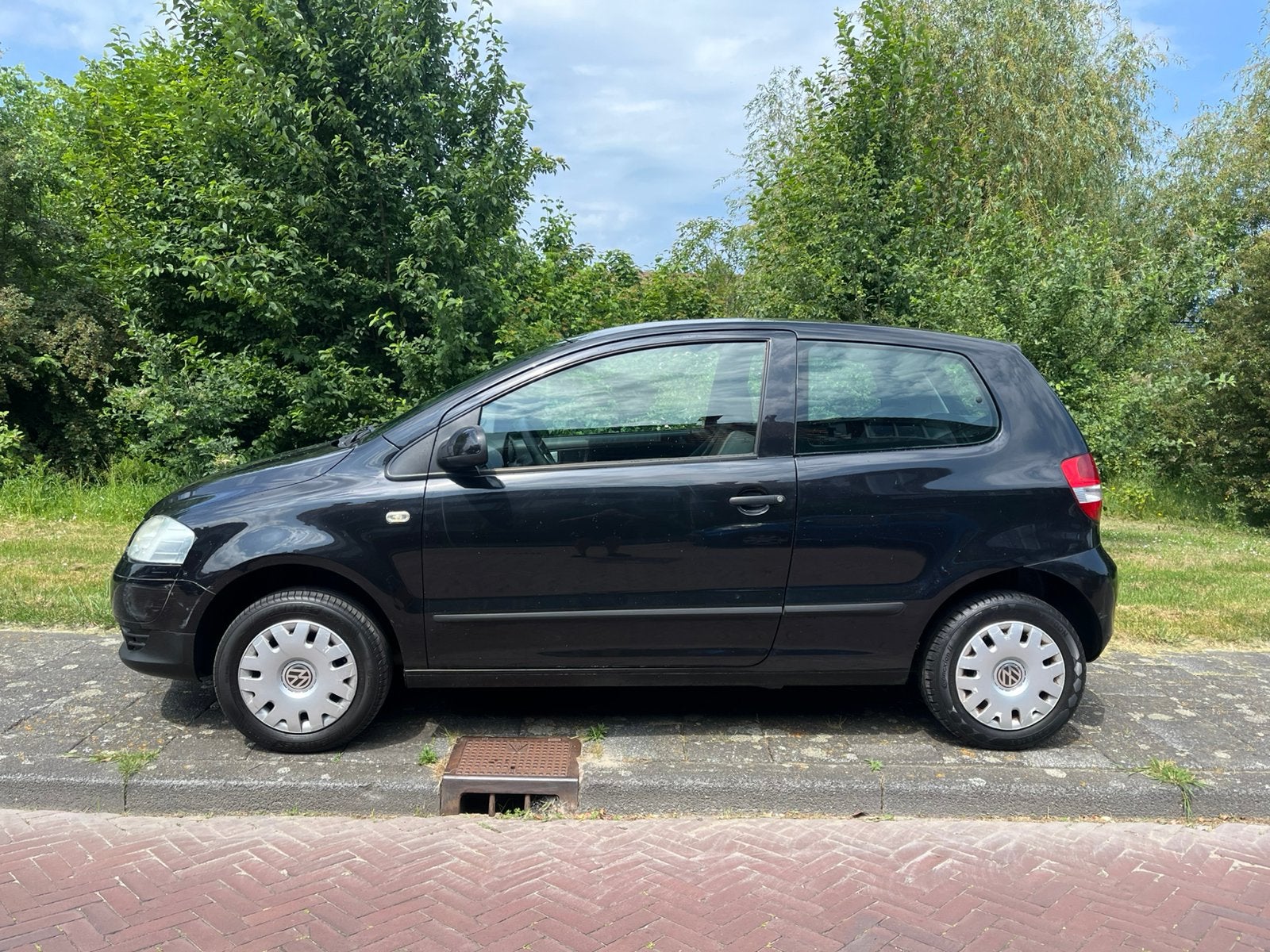 Volkswagen Fox 1.4 55KW 2005 Zwart, Auto's, Voorwielaandrijving, 15 km/l, 4 cilinders, 4 stoelen