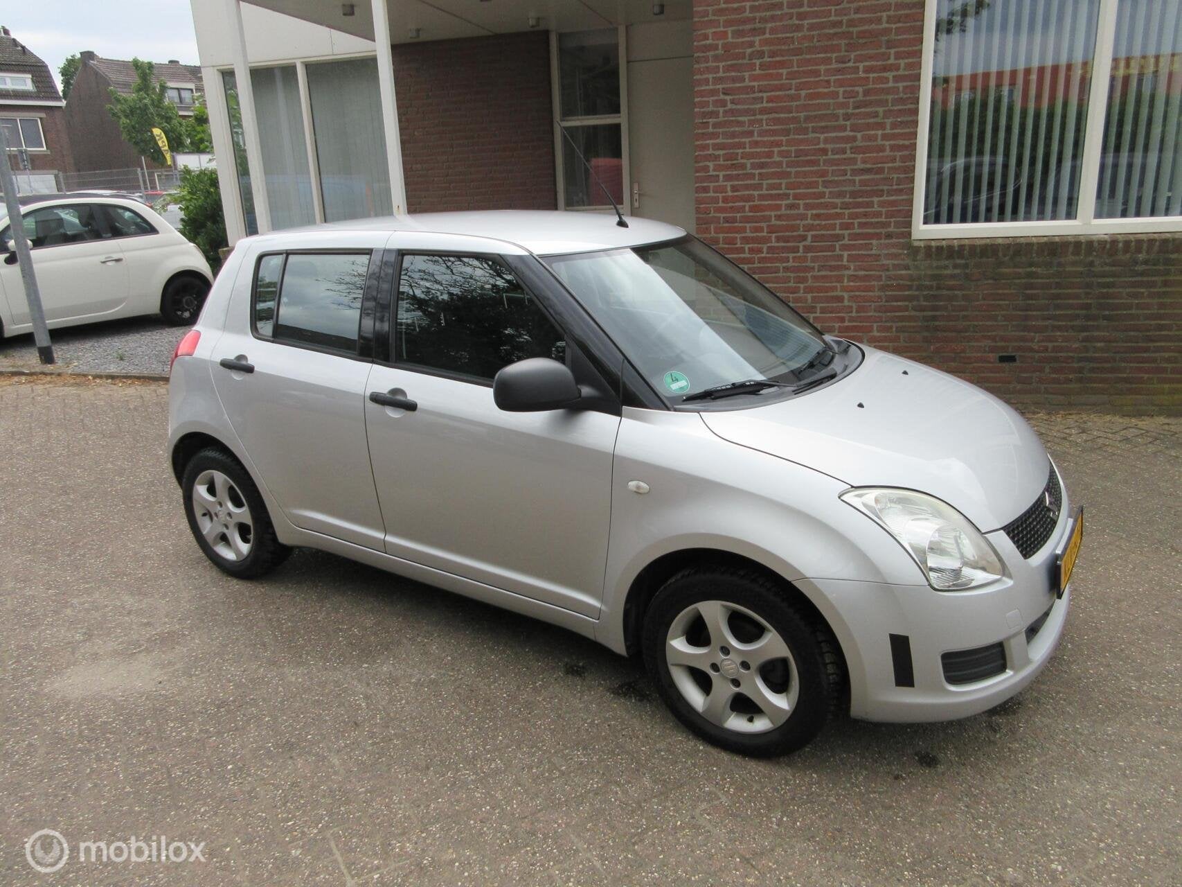 Suzuki Swift 1.3 Base / 2009 / 1.3 / 173509km / Airco / 5drs, Auto's, Suzuki, Voorwielaandrijving, Stof, Gebruikt, 400 kg
