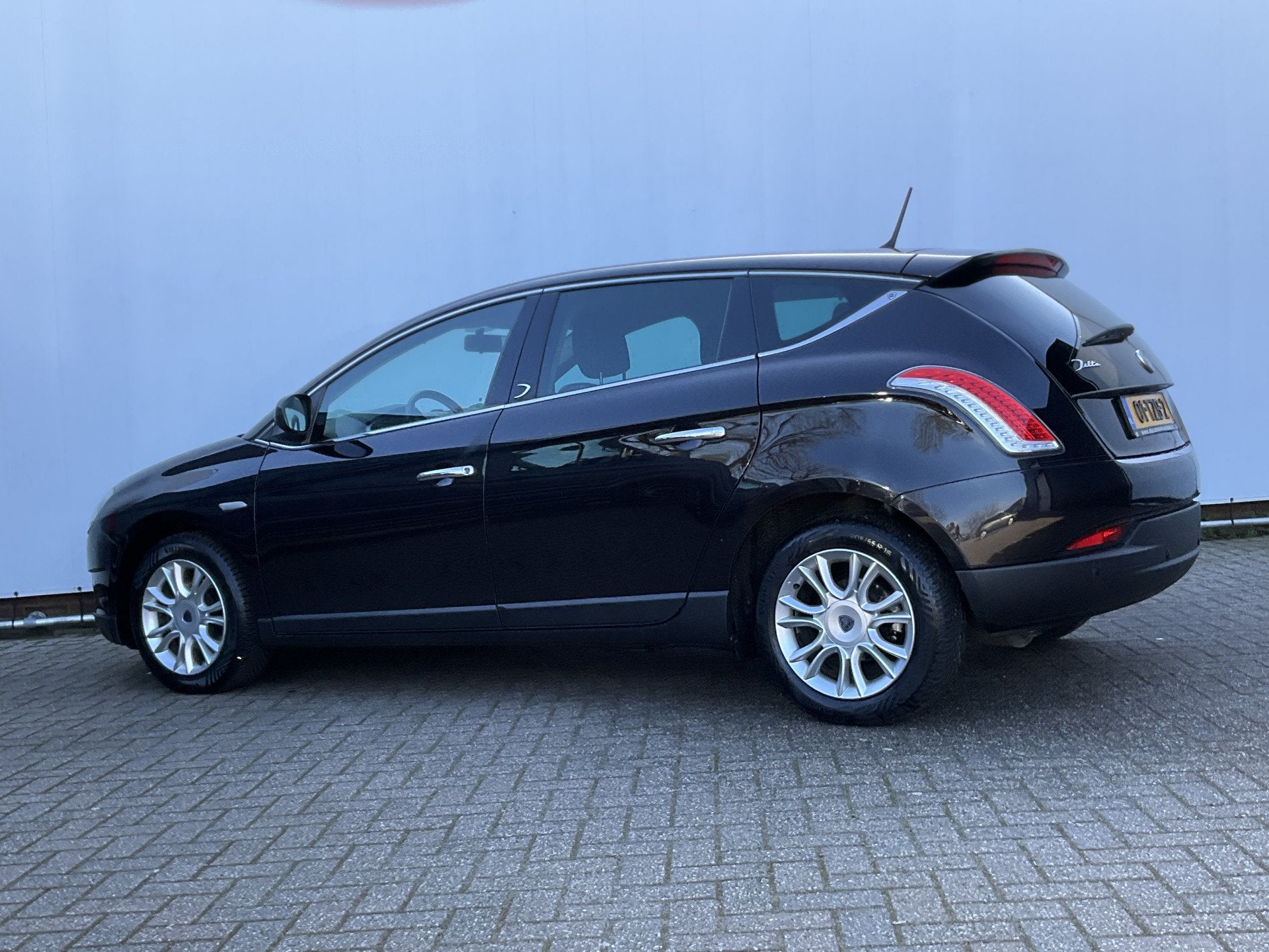 Lancia Delta 1.6-16V Silver Parrot Airco Goed onderhouden!, Auto's, Euro 5, Gebruikt, 4 cilinders, Zwart
