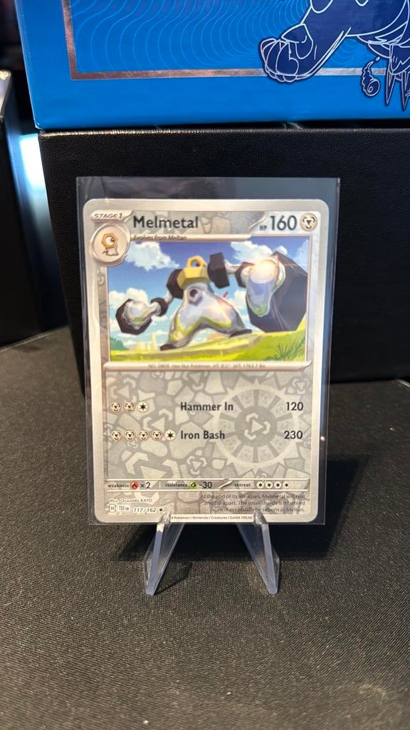 Melmetal 117/162 reverse holo, Ophalen of Verzenden, Zo goed als nieuw