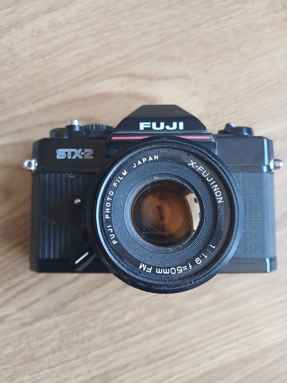 Fuji STX-2 spiegelreflexcamera  X-Fujinon 1:1.9 f=50mm FM, Ophalen