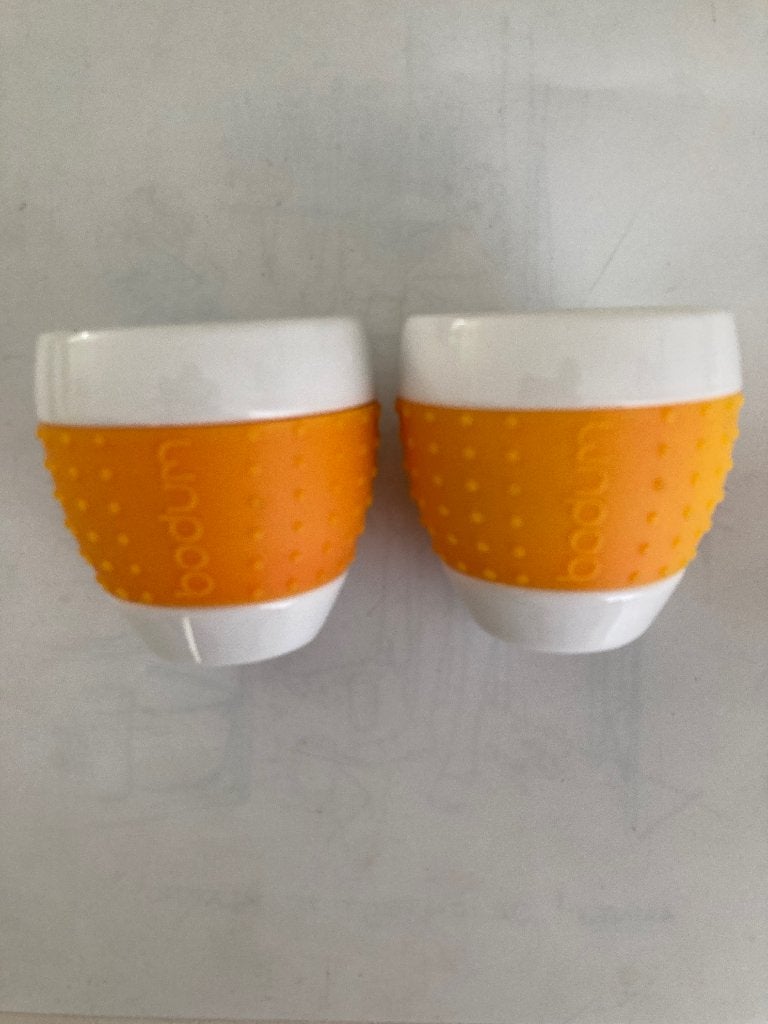 Bodum Pavina mok porselein oranje siliconen grip 70 ml, Huis en Inrichting, Overige merken, Nieuw, Ophalen of Verzenden, Overige stijlen
