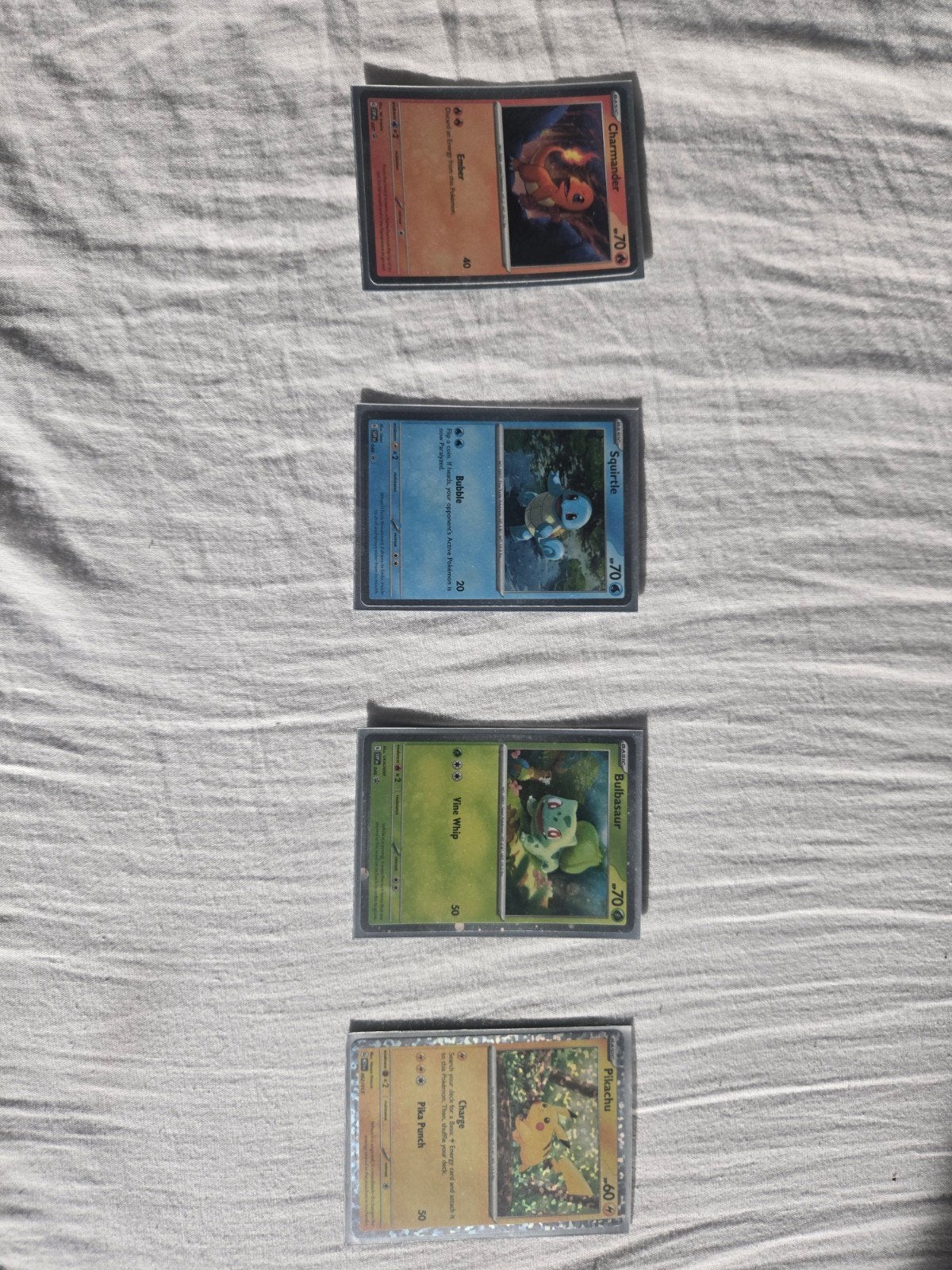 Pokémon Kaarten: Pikachu, Bulbasaur, Charmander, Squirtle, Ophalen of Verzenden, Zo goed als nieuw, Meerdere kaarten
