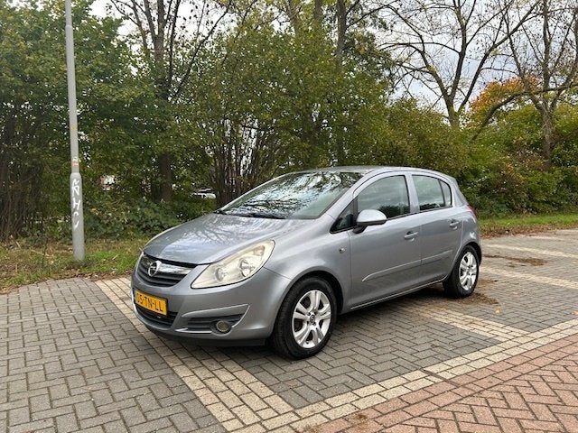 Opel Corsa 1.2 16V 5D WR 2006 Grijs, Stof, Elektrische ramen, 4 cilinders, 1229 cc