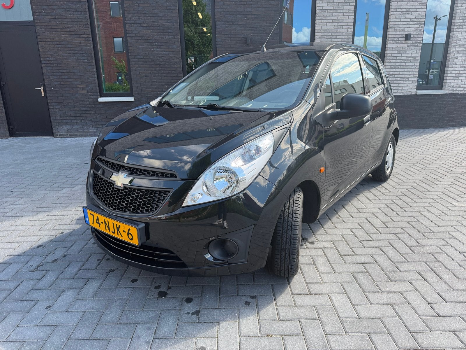 Chevrolet Spark 1.0 benzine 2010 Zwart Airco, Auto's, Voorwielaandrijving, 839 kg, 4 cilinders, Origineel Nederlands