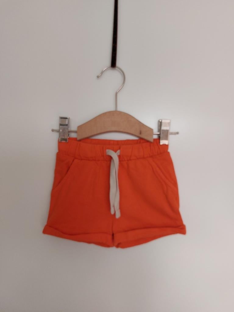 Hema oranje short maat 74 z.g.a.n., Ophalen of Verzenden, Zo goed als nieuw, Hema, Broekje