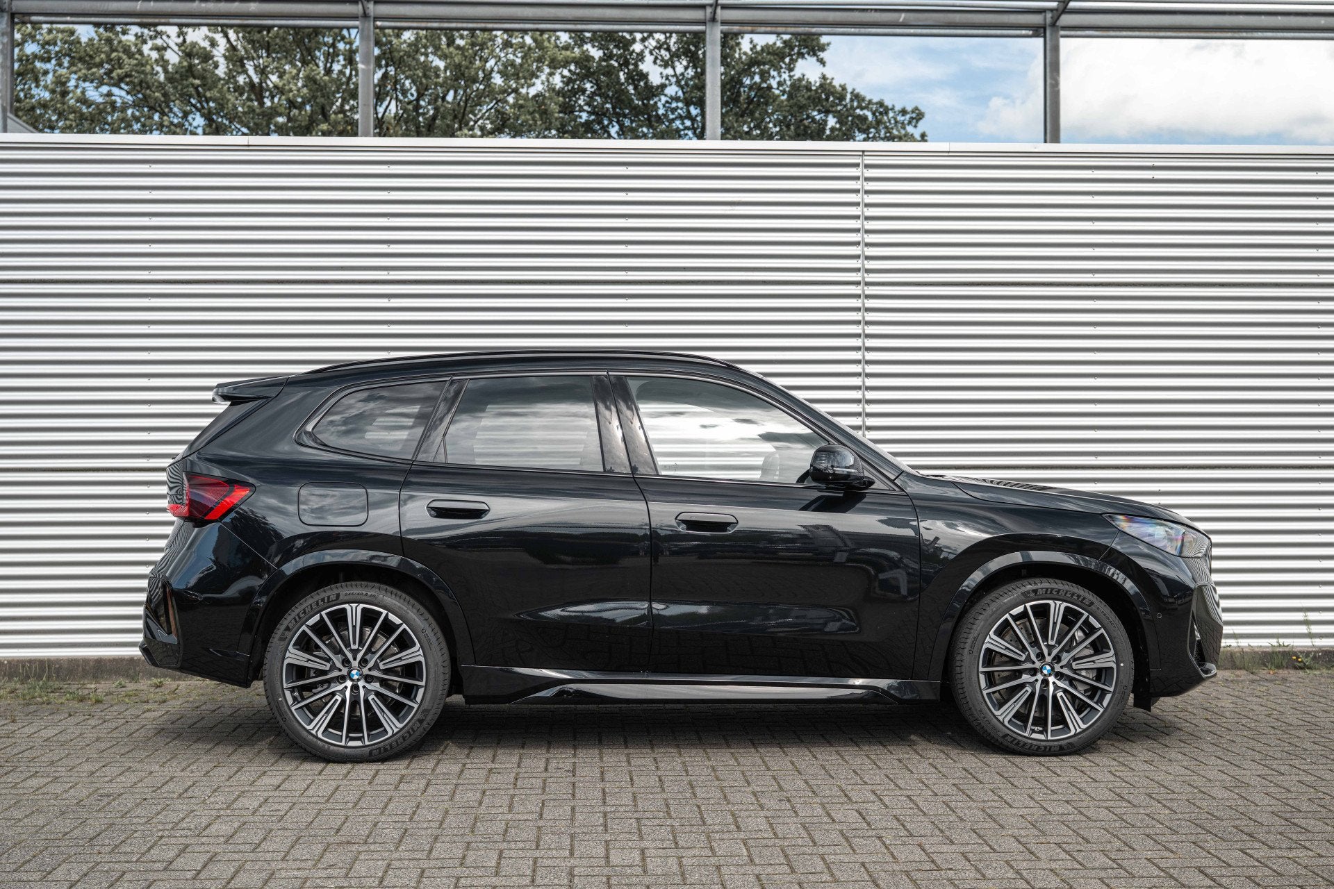 BMW X1 xDrive30e M Sport Automaat / Panoramadak / Trekhaak /, Auto's, Stoelverwarming, Zwart, Leder, Hybride Elektrisch/Benzine