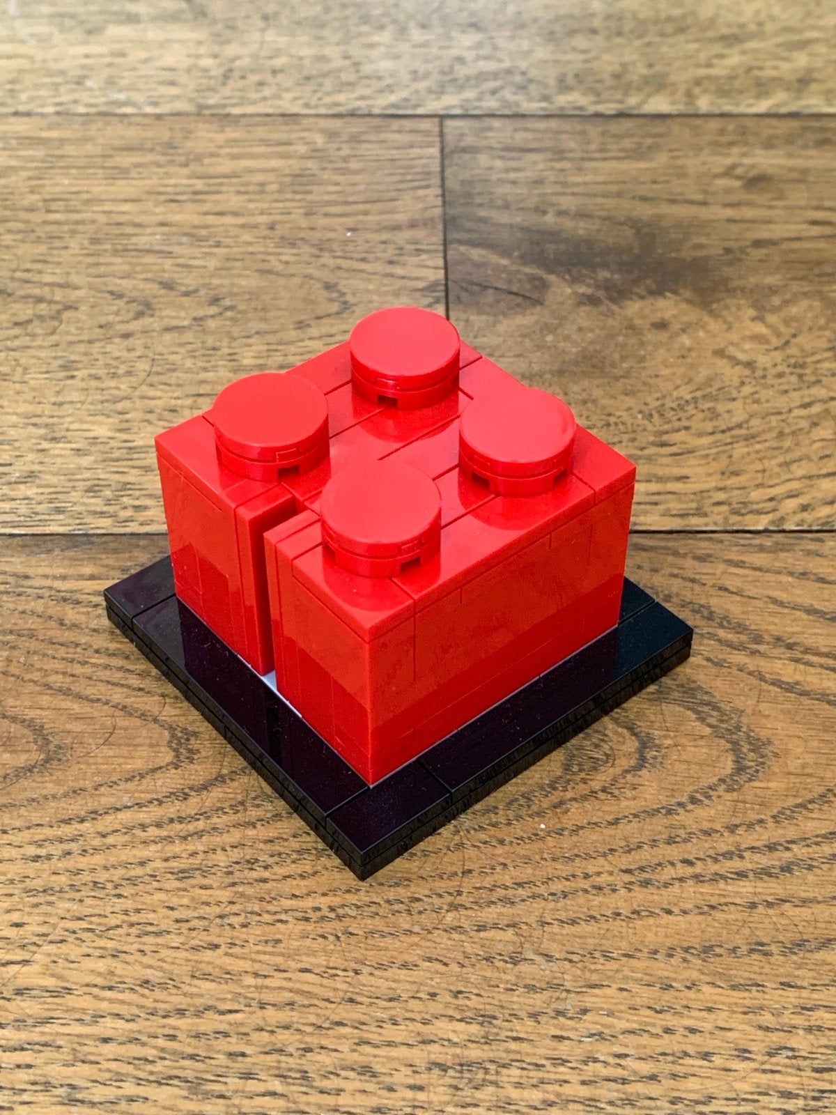 Rode Lego steen op zwarte plaat, Ophalen of Verzenden, Zo goed als nieuw, Overige merken