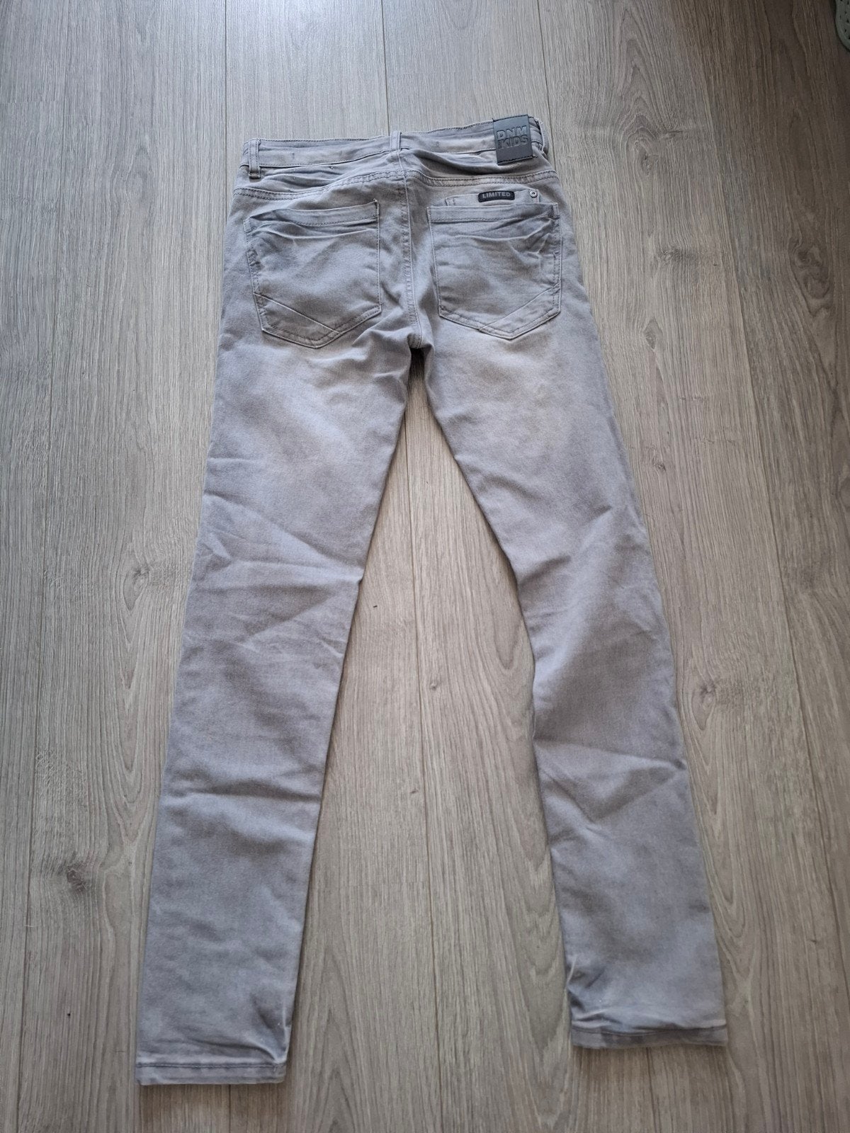 Grijze skinny fit jeans van DNM Kids, maat 164, Kinderen en Baby's, Broek, Gebruikt, Jongen of Meisje, Ophalen of Verzenden