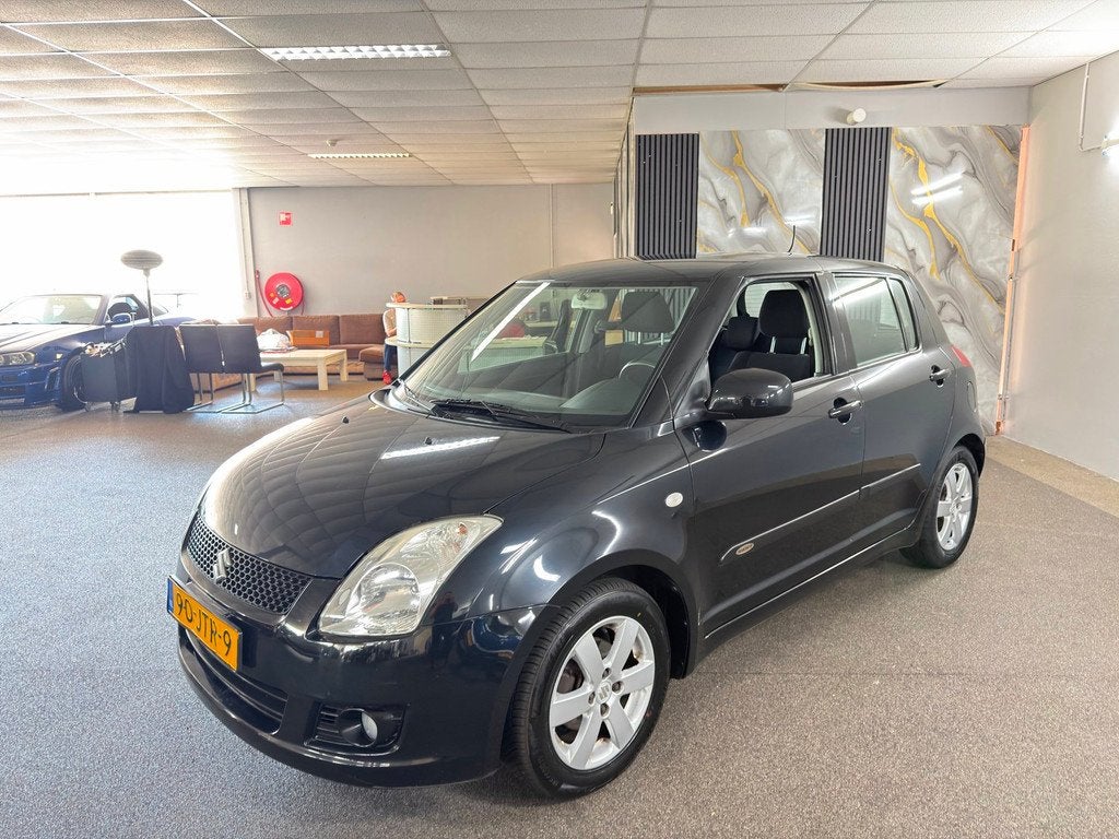 Suzuki Swift 1.3 Shogun Apk Nieuw,2e Eigenaar,Airco,N.A.P,E-, Auto's, Voorwielaandrijving, Stof, Zwart, 400 kg