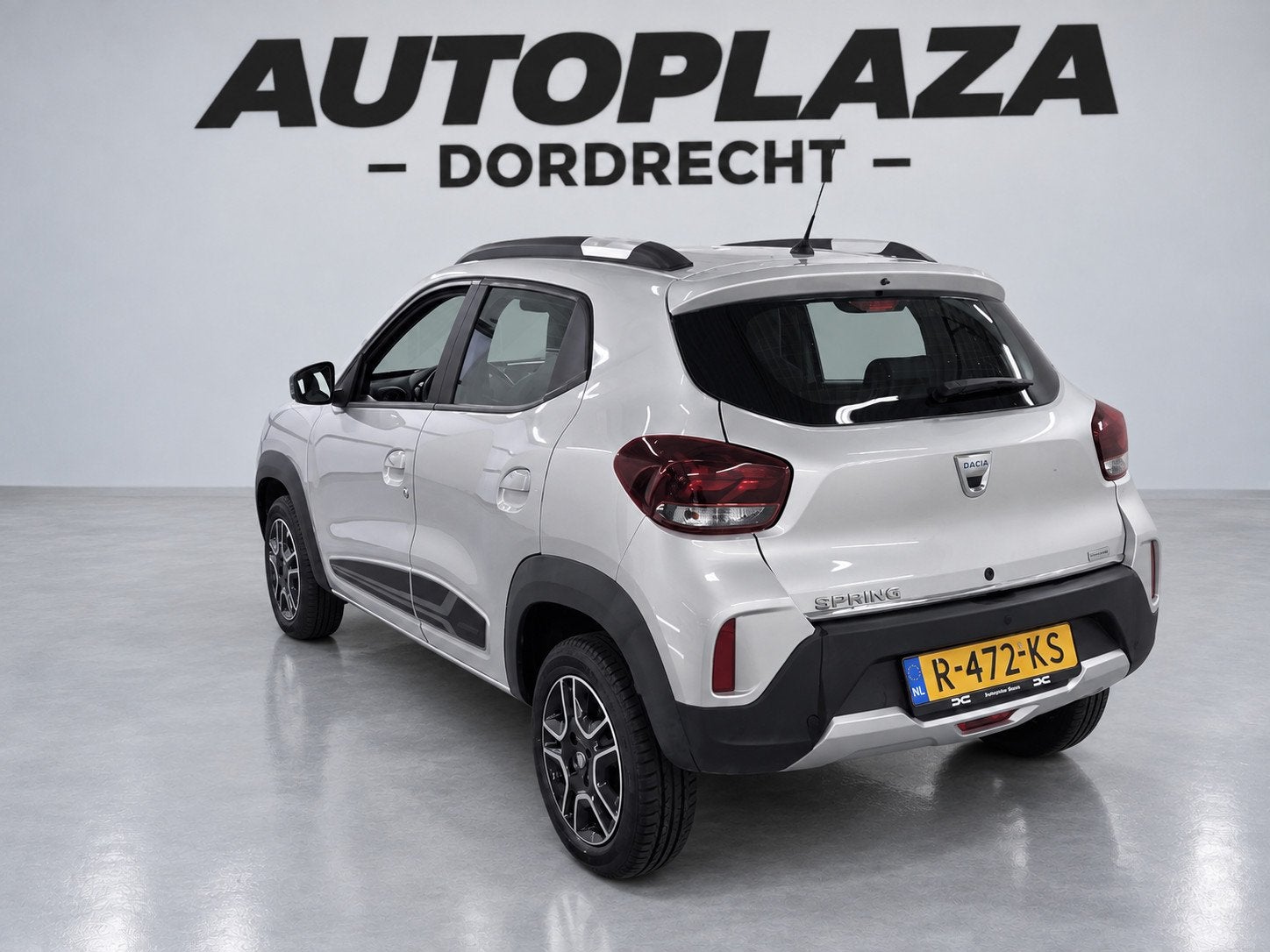 Dacia Spring Comfort Plus (Orange Pack) 27 kWh- SOH 89% |Cam, Auto's, Dealer onderhouden, Stof, Gebruikt, 230 km