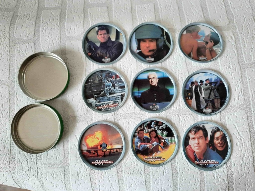 9 Heineken's bier onderzetters in rond blik James Bond, Verzamelen, Ophalen of Verzenden, Gebruikt, Viltje(s), Heineken