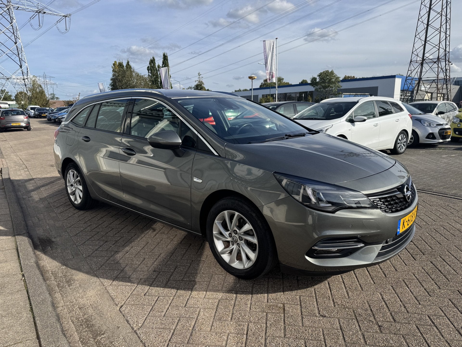 Opel Astra Sports Tourer 1.2 Business Elegance (bj 2021), Auto's, Voorwielaandrijving, 1199 cc, Leder en Stof, Origineel Nederlands