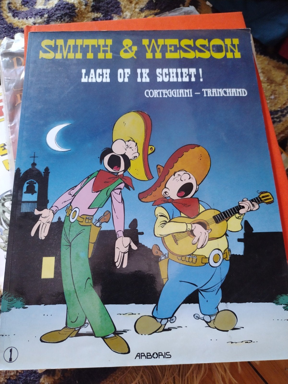 Smith&Wesson Lach of ik schiet!, Boeken, Stripboeken, Zo goed als nieuw, Eén stripboek, Ophalen of Verzenden