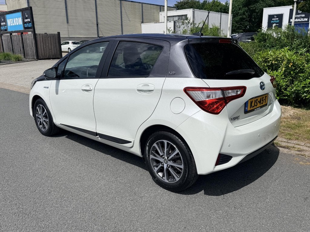 Toyota Yaris 1.5 Hybrid 100PK Y20 Automaat•Camera, Auto's, Toyota, Gebruikt, Euro 6, 4 cilinders, Wit