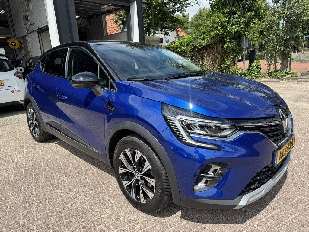 Renault Captur 1.6 E-Tech Hybrid 145 Intens, Gebruikt, 715 kg, Blauw, Leder en Stof
