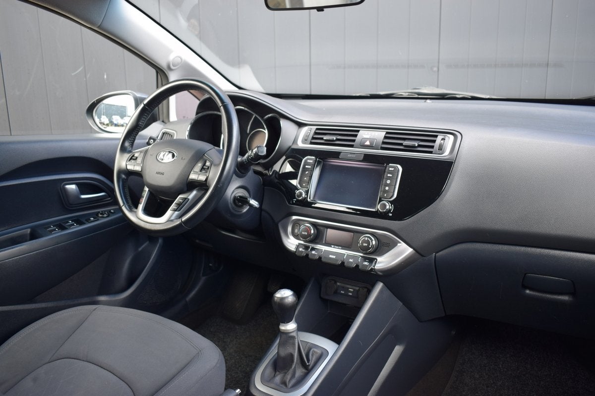 Kia Rio 1.2 CVVT ExecutiveLine ECC | Full Map Navi | Camera, 1027 kg, 4 cilinders, Met garantie (alle), Bedrijf