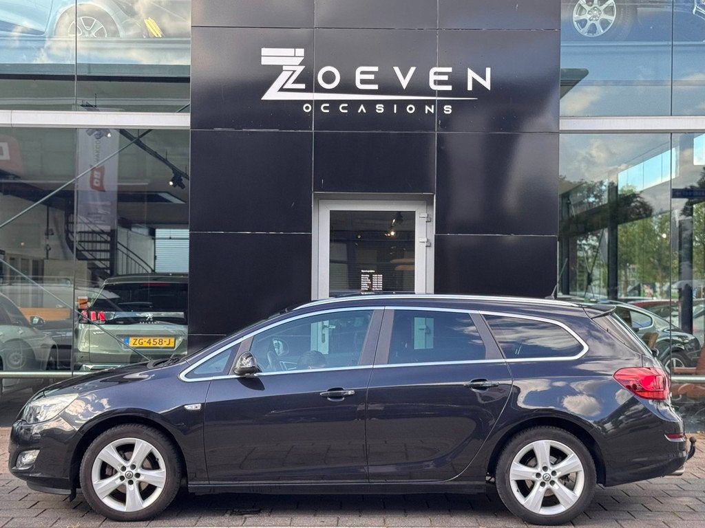 Opel Astra Sports Tourer 1.4 Turbo Cosmo, Auto's, Opel, Voorwielaandrijving, Euro 5, Stof, Gebruikt