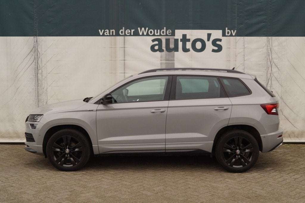 Skoda Karoq 1.5 TSI 150pk DSG Sportline Business -LEER-ECC-, Auto's, Skoda, 4 cilinders, 150 pk, Bedrijf, 690 kg