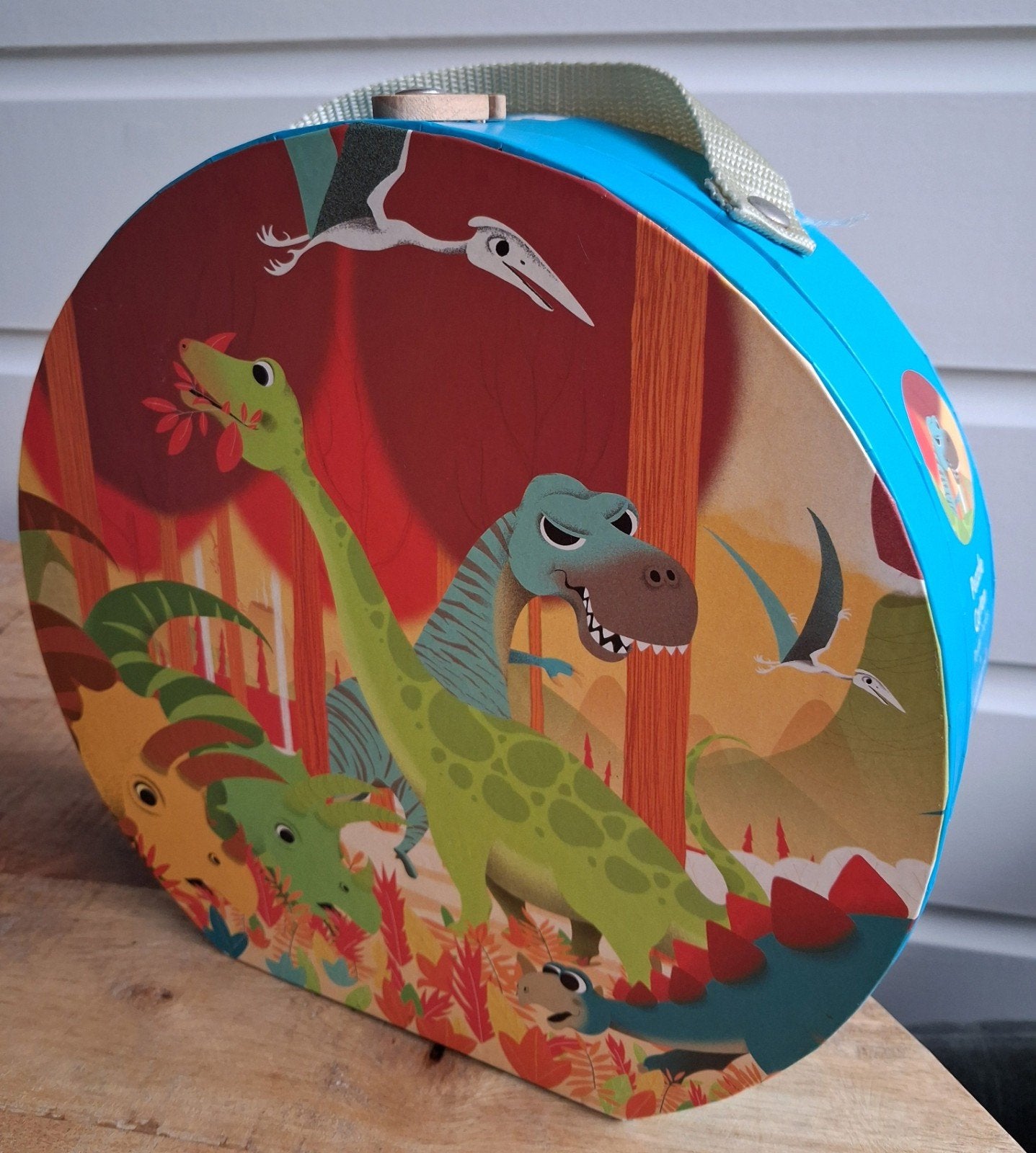 Janod - Dino puzzel 24 stukjes in ronde koffer, Ophalen of Verzenden, 10 tot 50 stukjes