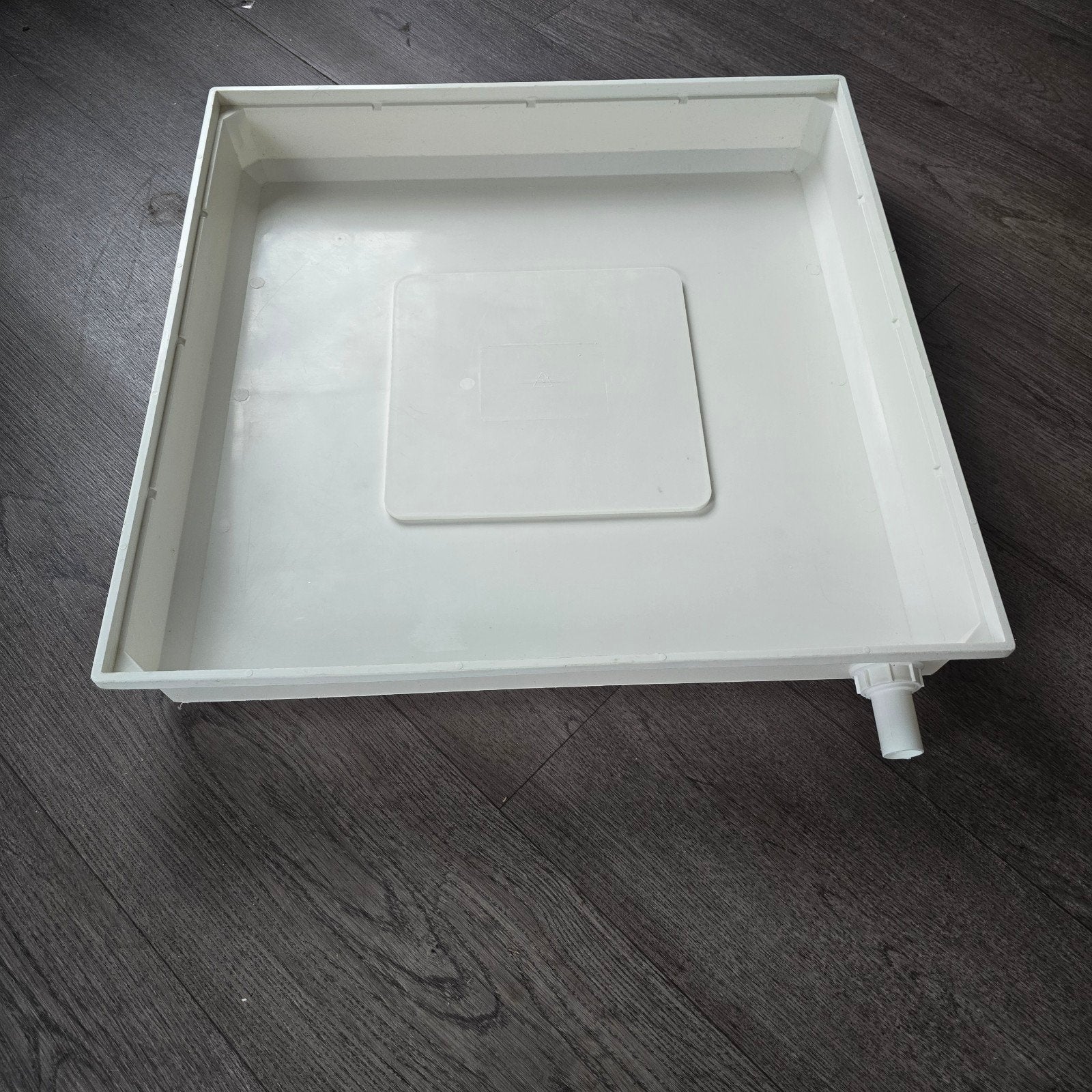 wasmachine  lekbak, Ophalen