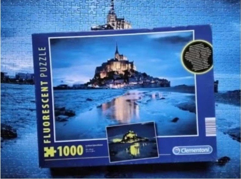 Clementoni fluorescent puzzel 'Le Mont Saint-Michel', Ophalen, 500 t/m 1500 stukjes, Zo goed als nieuw, Legpuzzel
