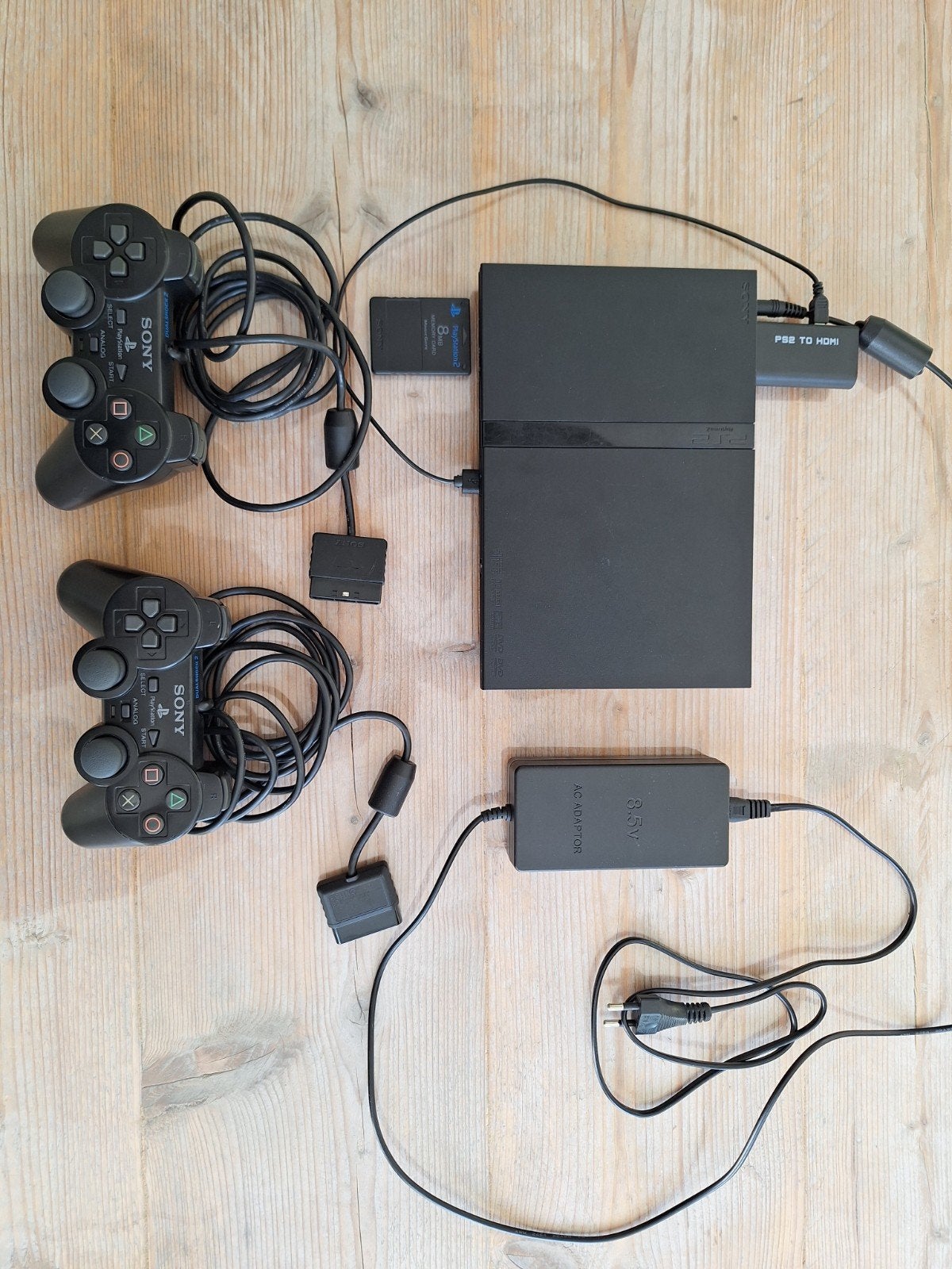 PlayStation 2 Slim met 6 games, 2 controllers, HDMI-adapter, Gebruikt, Racen en Vliegen, 2 spelers, Eén computer