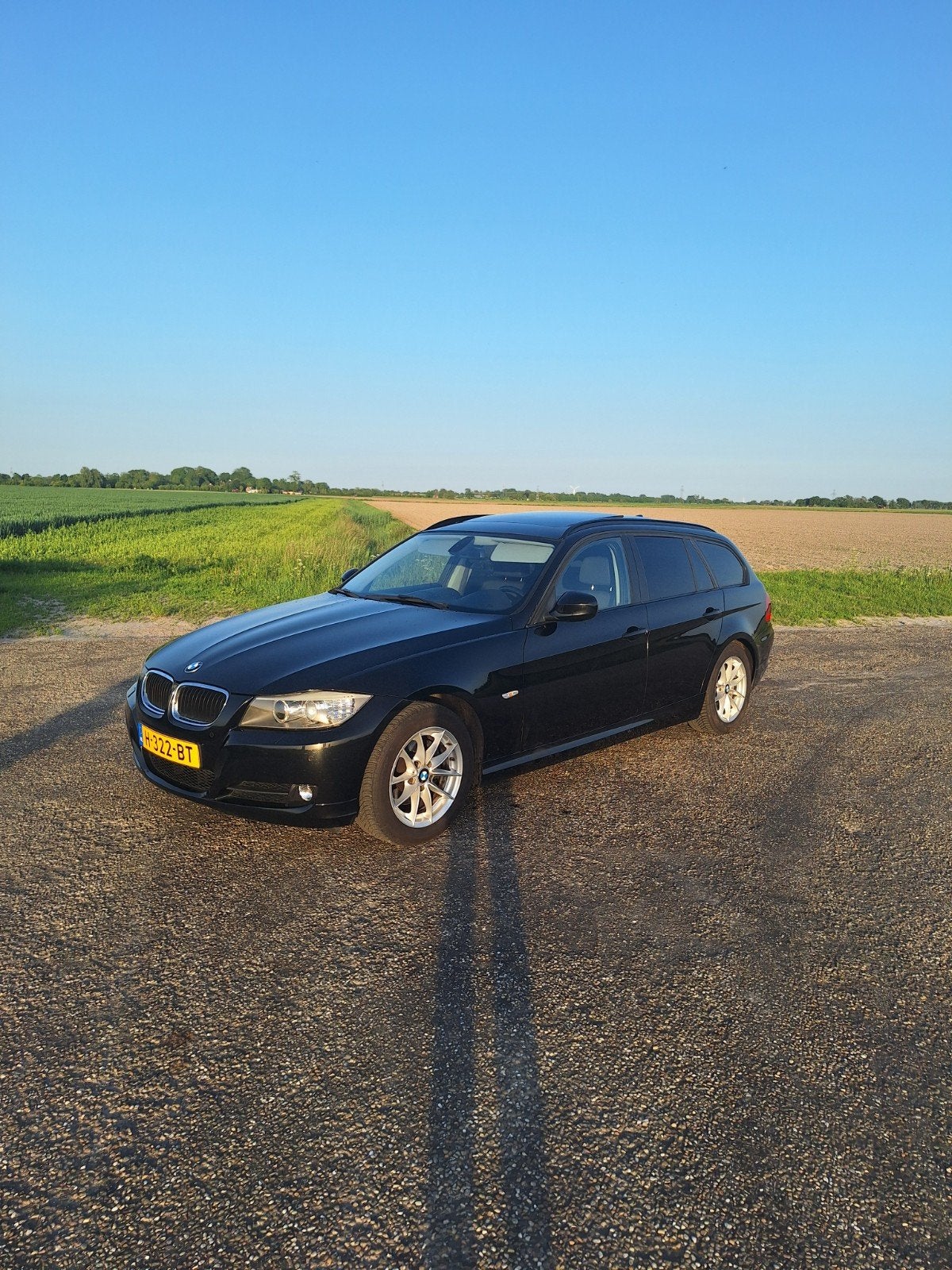 BMW 3-Serie 318i 143pk 2010 Zwart, Auto's, Achterwielaandrijving, Zwart, Leder en Stof, Zwart