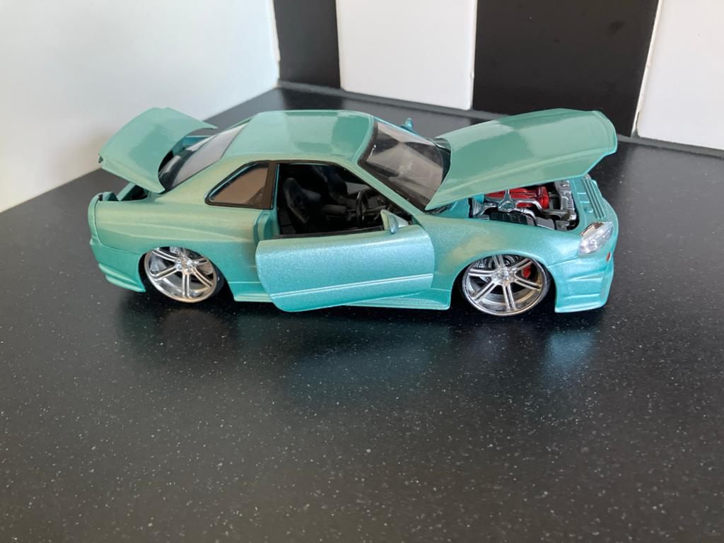 Modelauto Nissan Skyline GRE R34 1/24, Ophalen of Verzenden, Bburago
