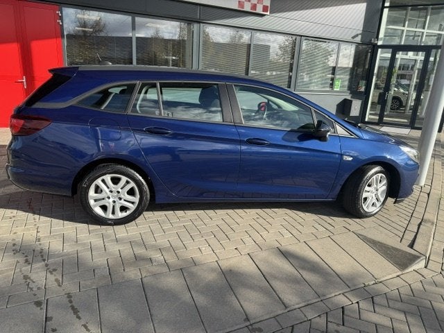 Opel Astra Sports Tourer 1.2 Bns Edition, Auto's, Stof, Gebruikt, Euro 6, 1199 cc