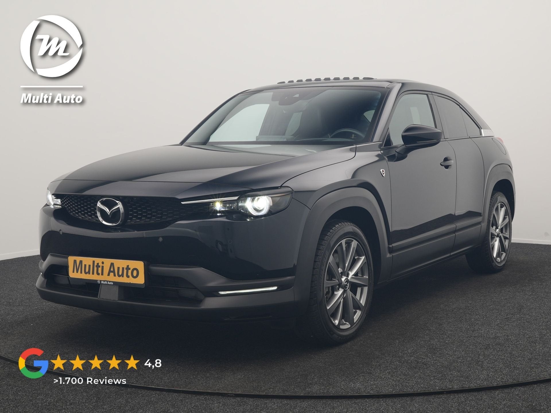 Mazda MX-30 e-SkyActiv R-EV 170 Makoto PHEV 170pk | Trekhaak, Auto's, Mazda, Gebruikt, Zwart, Leder en Stof, Zwart