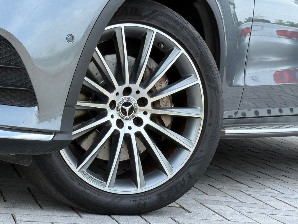 Mercedes-Benz GLC-klasse Coupé 250 4MATIC AMG Kanteldak 360, Auto's, Mercedes-Benz, Automaat, Gebruikt, Zwart, 4 cilinders