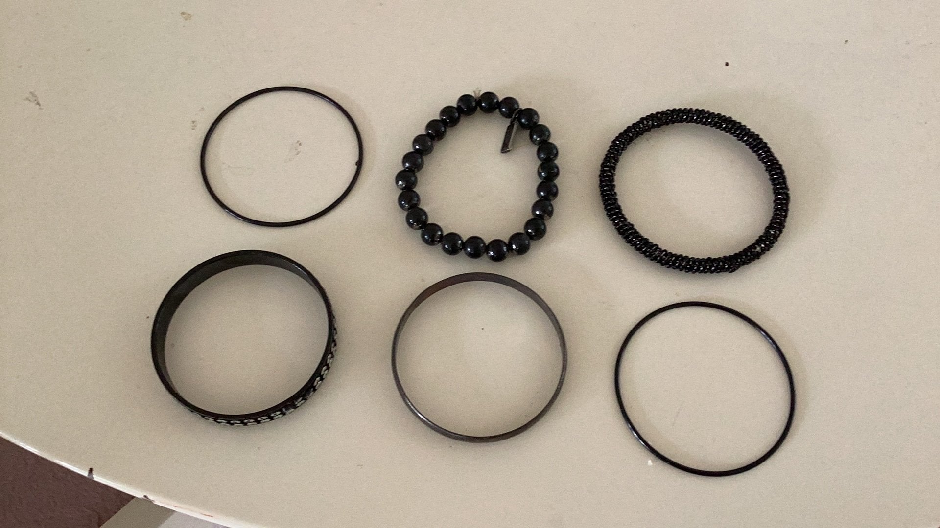 6 zwarte slaven armbanden, Ophalen of Verzenden, Zo goed als nieuw, Overige typen