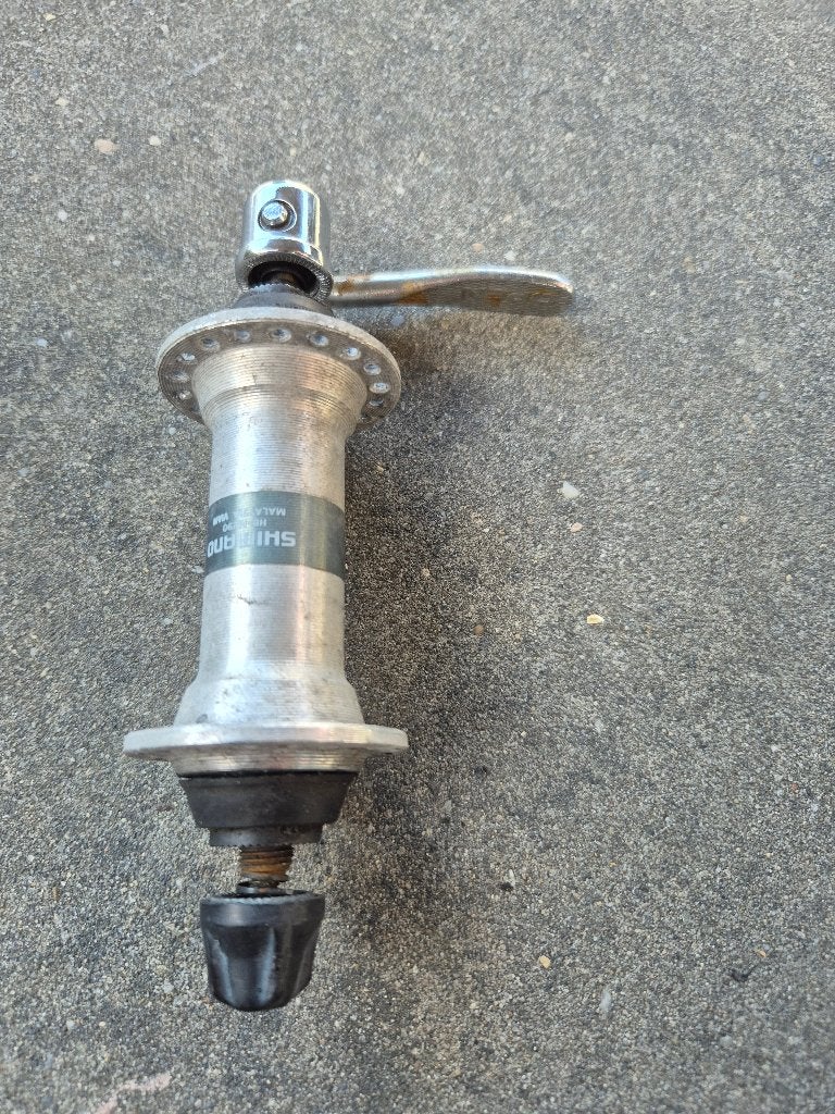 Shimano voorwiel steekas met snelspanner, Ophalen of Verzenden