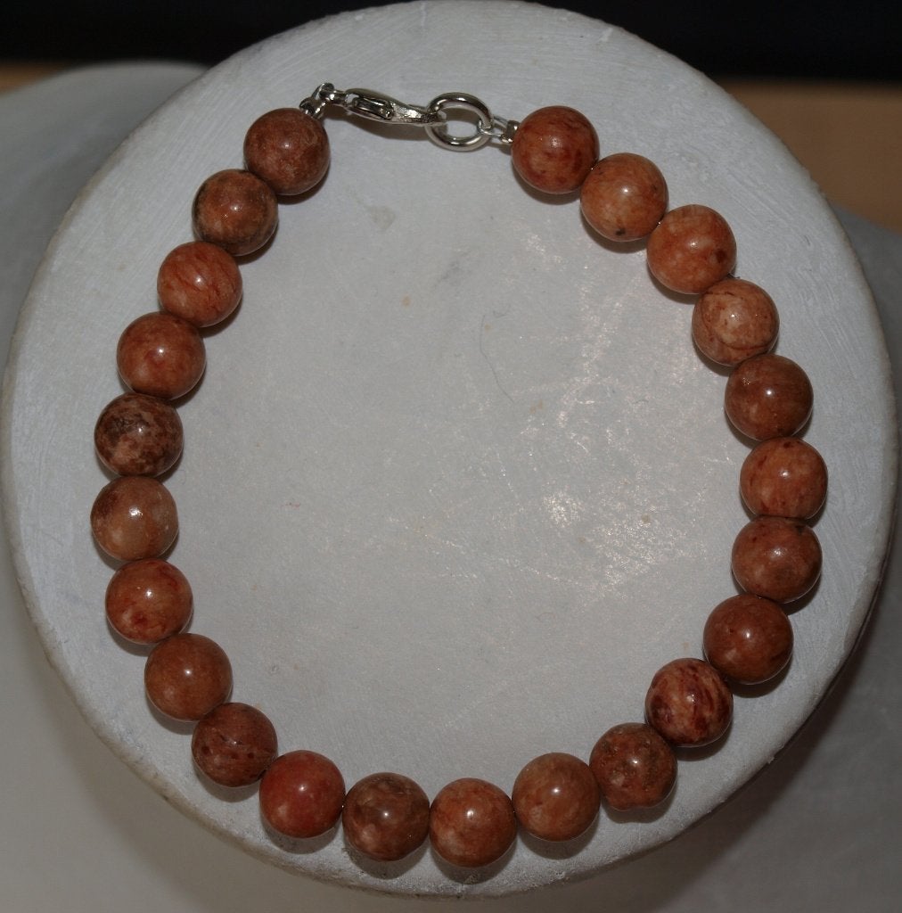 Mooie kralenarmband met oranje/bruine kralen, Overige materialen, Bruin, Nieuw, Ophalen of Verzenden