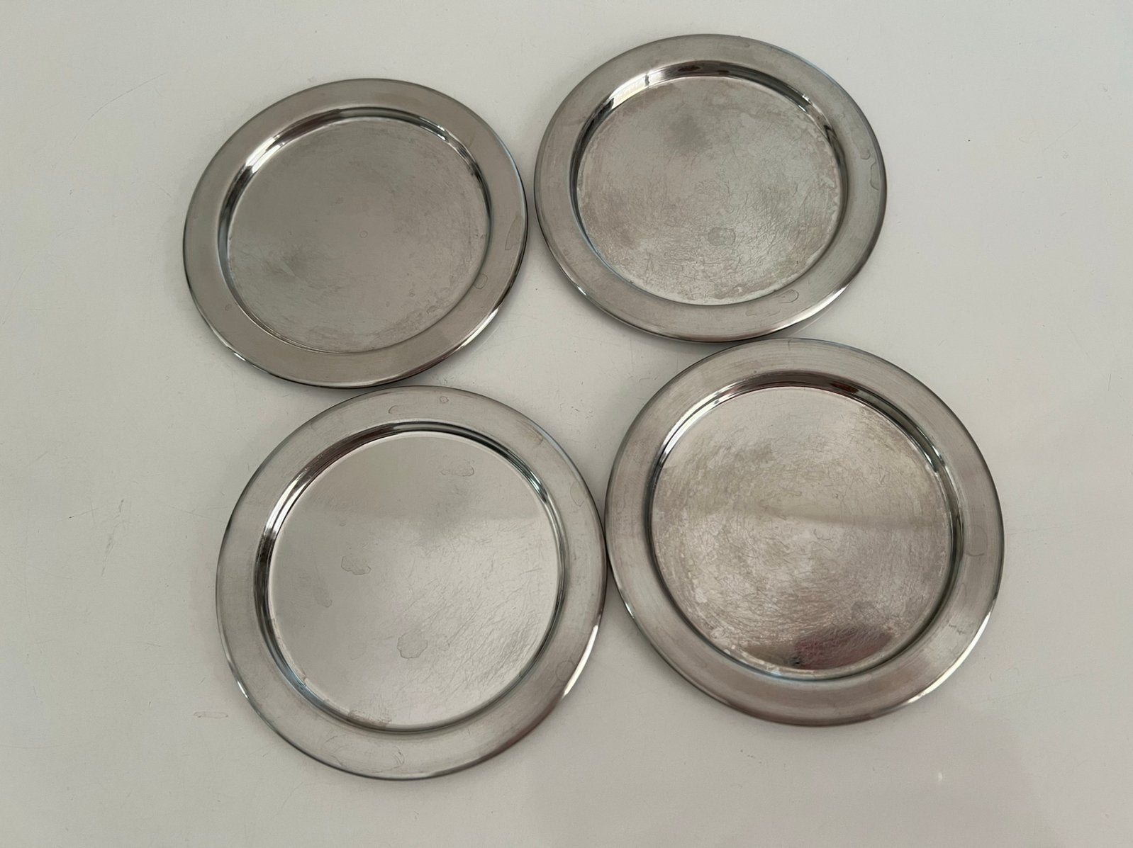 Set van 4 Iittala RVS Onderzetter Coaster Timo Sarpaneva, Huis en Inrichting, Ophalen of Verzenden, Glasonderzetter, Gebruikt