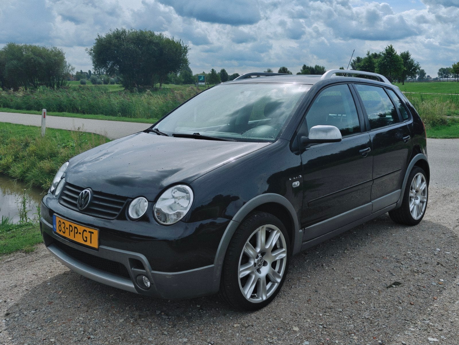Volkswagen Polo 1.4 FSI FUN  CROSS 63KW 2004 Zwart, Auto's, Voorwielaandrijving, 4 cilinders, Zwart, Origineel Nederlands