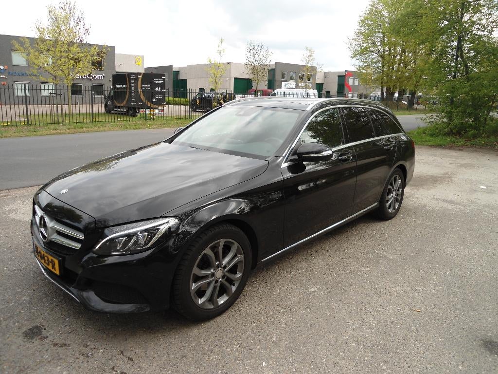 Mercedes-Benz C-Klasse 1.6 C180 Estate 2015 Zwart, Auto's, Automaat, Achterwielaandrijving, 1800 kg, Leder en Stof