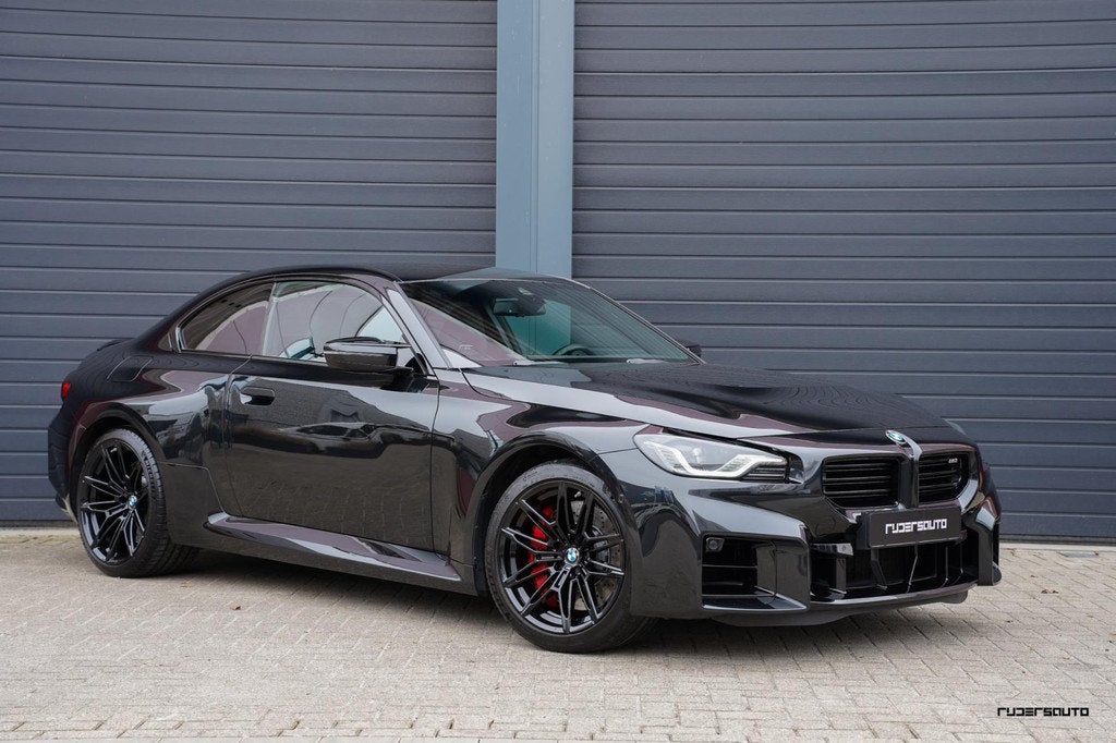 BMW M2 G87 | Handgeschakeld | Camera | HK | Sportstoelen + m, Auto's, BMW, Achterwielaandrijving, Zwart, Zwart, Leder