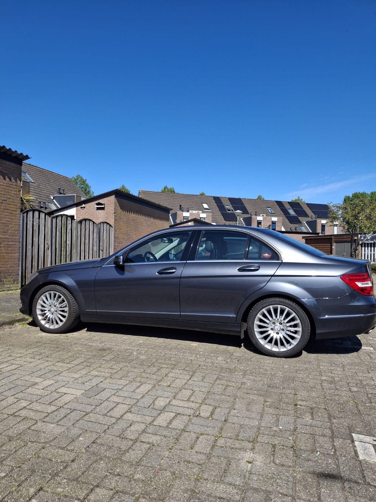 Mercedes-Benz C-Klasse 1.6 C180 Kompr. Sedan AUT 2012 Grijs, Auto's, Mercedes-Benz, Euro 5, Achterwielaandrijving, Leder en Stof