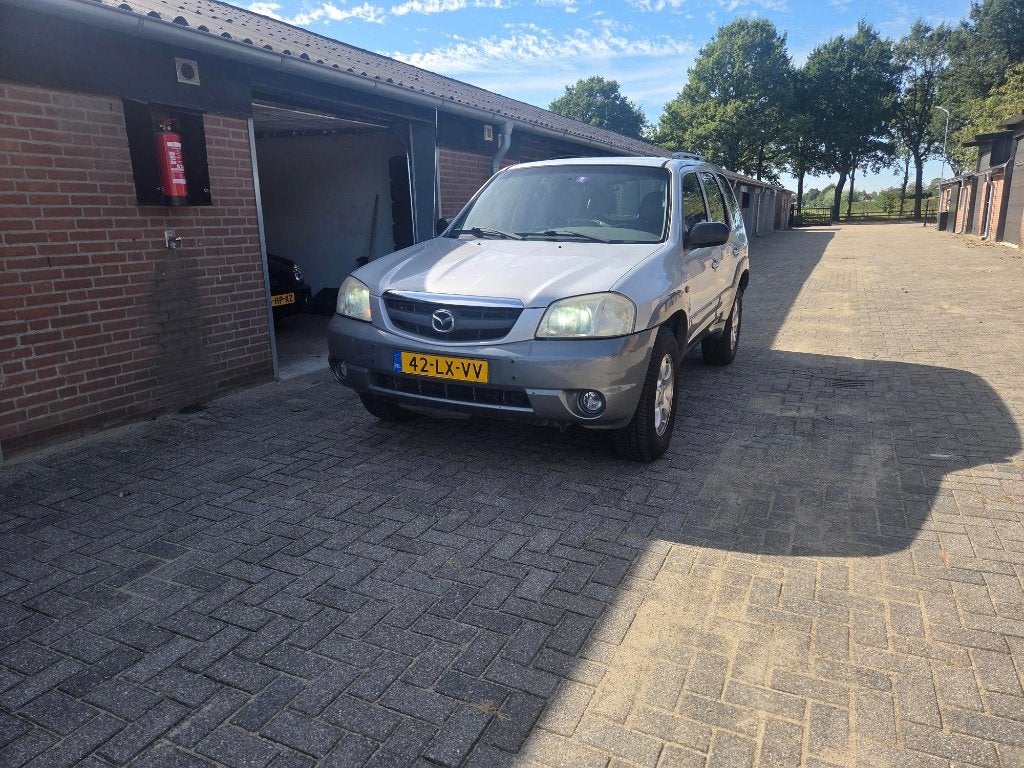 Mazda Tribute 3.0 V6 Touring AUT 4WD 2003 Grijs, Auto's, Automaat, Origineel Nederlands, Particulier, 93 €/maand