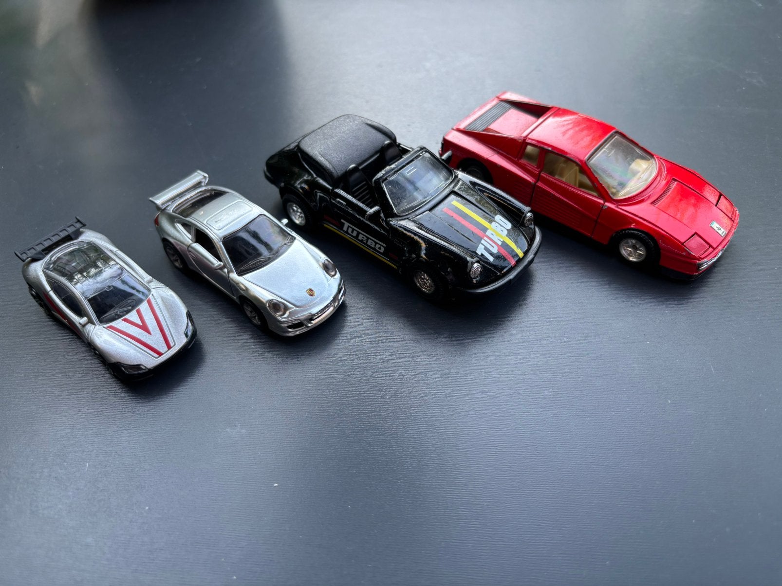 4 speelgoed auto’s (oa Porsche, Ferrari), Ophalen of Verzenden, Gebruikt