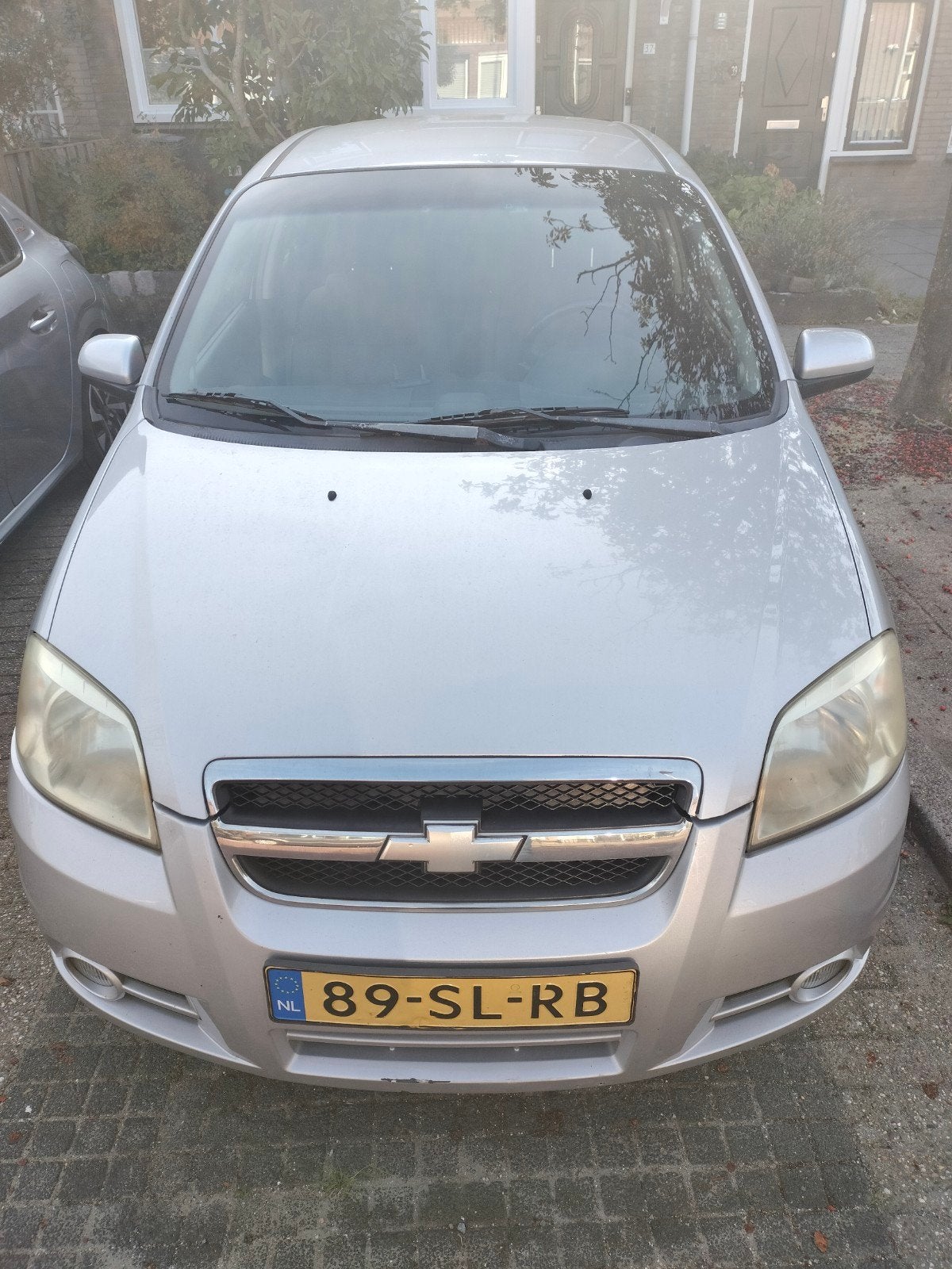 Chevrolet Aveo 1.4 16V 4D 2006 Grijs, Auto's, Voorwielaandrijving, 15 km/l, 40 €/maand, Aveo