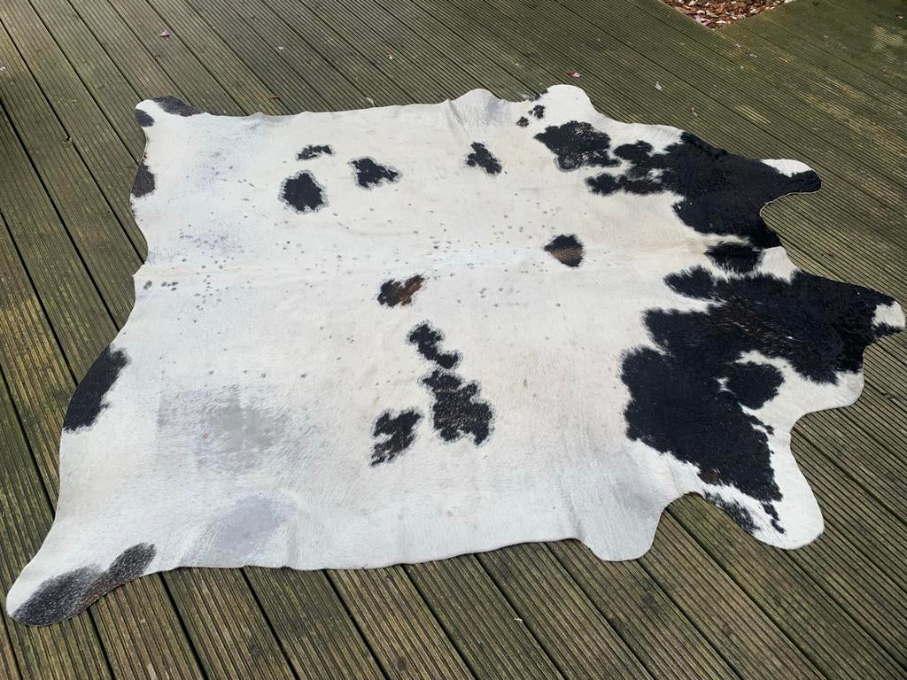Zwart-wit koeienhuid vloerkleed, Gebruikt, 100 tot 150 cm, Wit, Ophalen of Verzenden